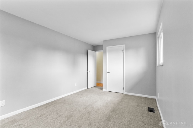 925 Robinette Ave, Vandalia, OH 45377 - unfurnished bedroom featuring baseboards and carpet flooring