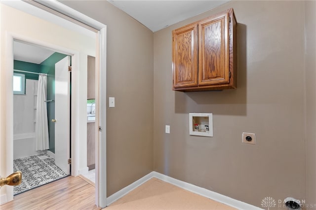 925 Robinette Ave, Vandalia, OH 45377 - laundry room with hookup for a washing machine, electric dryer hookup, cabinet space, and light wood-style floors