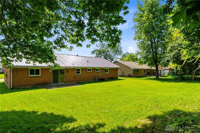 925 Robinette Ave, Vandalia, OH 45377 - back of property with brick siding and a metal roof