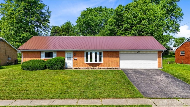 925 Robinette Ave, Vandalia, OH 45377 - ranch-style home with an attached garage, driveway, a front yard, and brick siding
