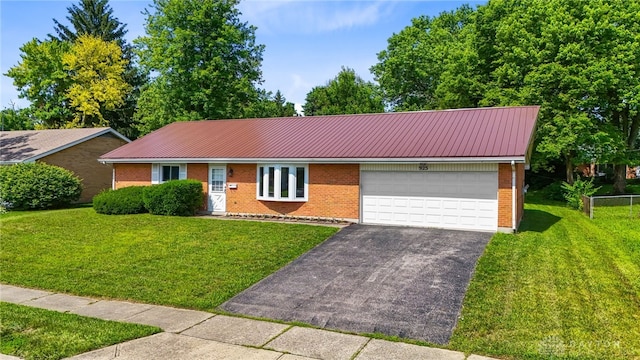 925 Robinette Ave, Vandalia, OH 45377 - ranch-style home featuring driveway, an attached garage, a metal roof, and brick siding
