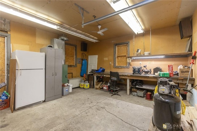 2817 Whittier Ave, Dayton, OH 45420 - garage featuring freestanding refrigerator and a workshop area