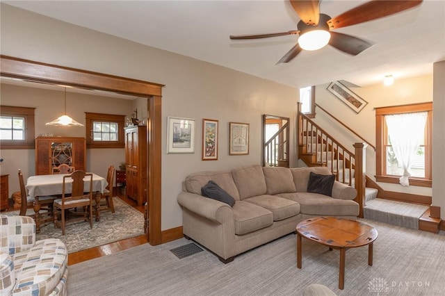 2817 Whittier Ave, Dayton, OH 45420 - living area featuring stairs, light wood-style flooring, and a ceiling fan