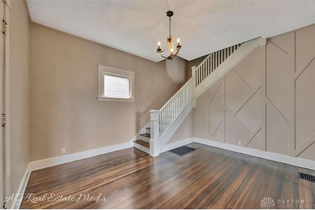 200 Garfield St, Middletown, OH 45044 - staircase featuring wood finished floors and a chandelier