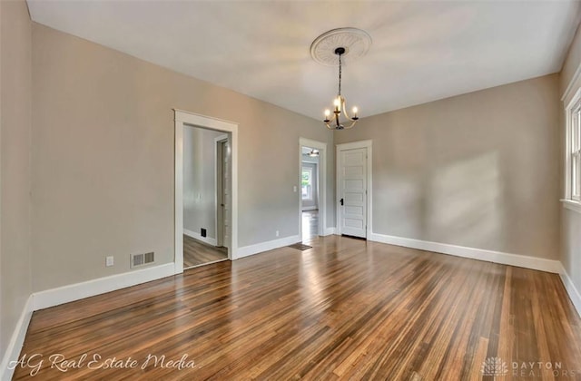 200 Garfield St, Middletown, OH 45044 - unfurnished room featuring a chandelier and wood finished floors