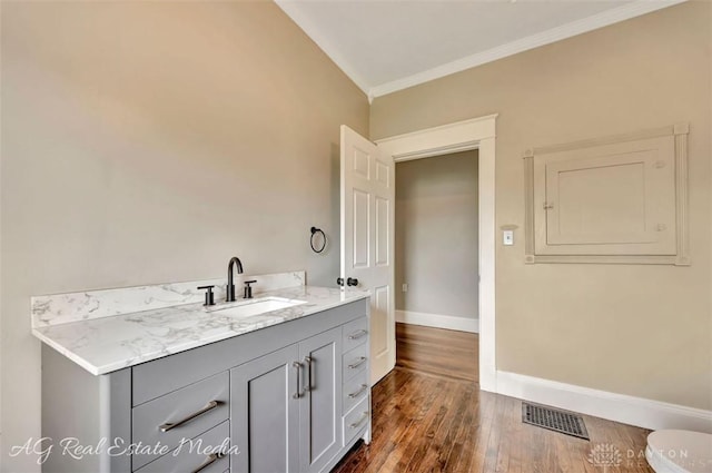 200 Garfield St, Middletown, OH 45044 - bathroom with ornamental molding, wood finished floors, and vanity