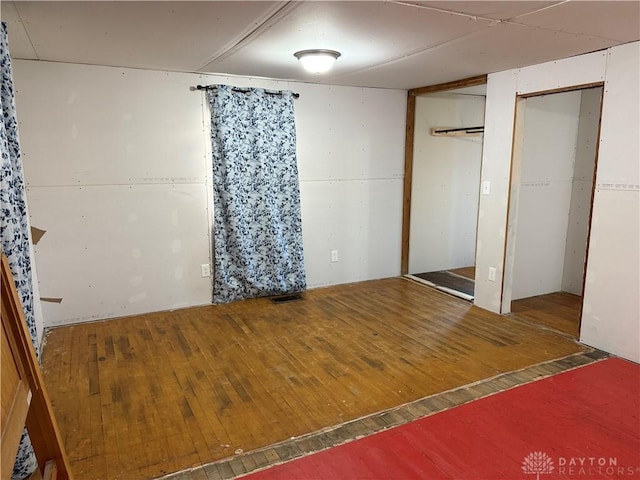 4904 Alpha Rd, Springfield, OH 45504 - unfurnished bedroom with wood-type flooring and multiple closets