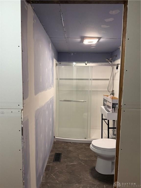 4904 Alpha Rd, Springfield, OH 45504 - bathroom featuring toilet and a shower stall