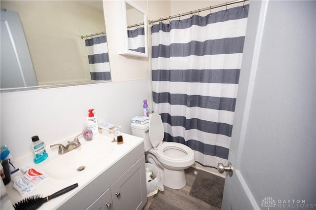 2107 Woodlawn Ave, Middletown, OH 45044 - bathroom with wood finished floors, vanity, and a shower with curtain