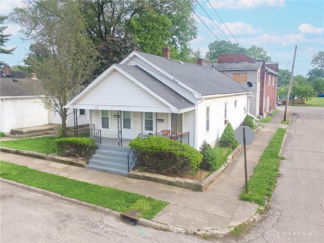 2107 Woodlawn Ave, Middletown, OH 45044 - bungalow with a porch and a chimney