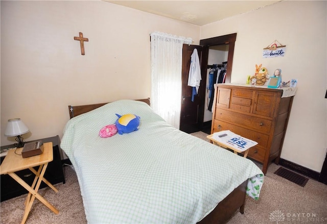 2107 Woodlawn Ave, Middletown, OH 45044 - bedroom featuring carpet floors, a closet, and a walk in closet