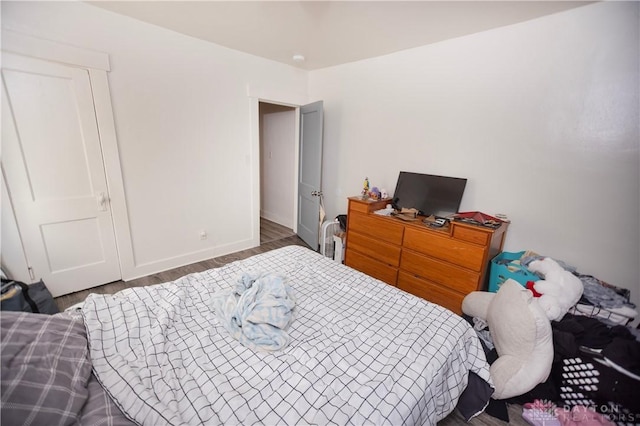 2107 Woodlawn Ave, Middletown, OH 45044 - bedroom featuring baseboards and wood finished floors