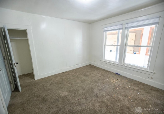 2107 Woodlawn Ave, Middletown, OH 45044 - unfurnished bedroom with carpet floors and multiple windows