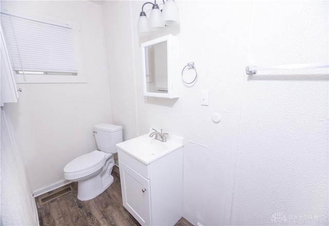 2107 Woodlawn Ave, Middletown, OH 45044 - half bathroom with vanity and wood finished floors