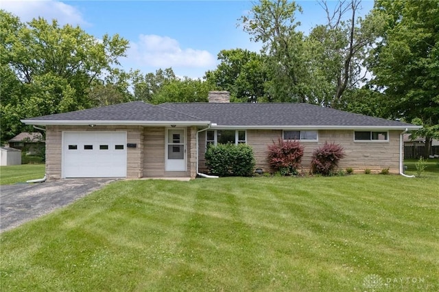 40 Rosewood Dr, Springboro, OH 45066 - ranch-style house featuring an attached garage, asphalt driveway, a chimney, a front lawn, and stone siding