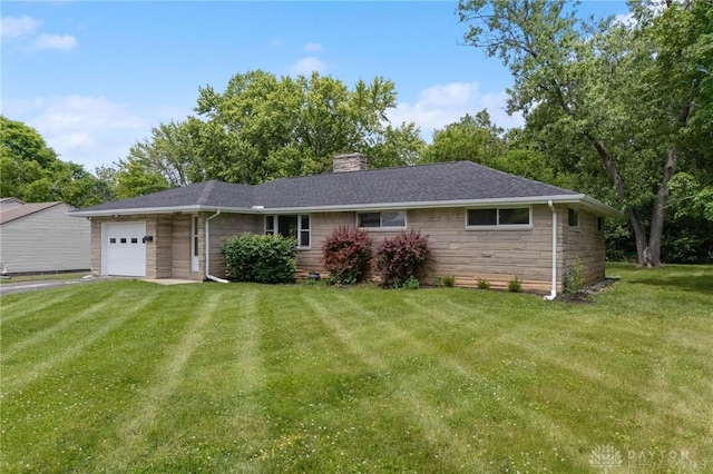 40 Rosewood Dr, Springboro, OH 45066 - ranch-style house featuring an attached garage, a chimney, a front yard, stone siding, and asphalt driveway