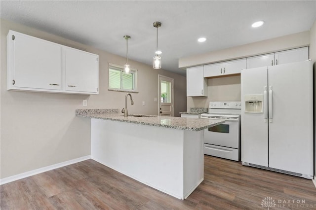 40 Rosewood Dr, Springboro, OH 45066 - kitchen with white appliances, white cabinets, dark wood-type flooring, a peninsula, and recessed lighting