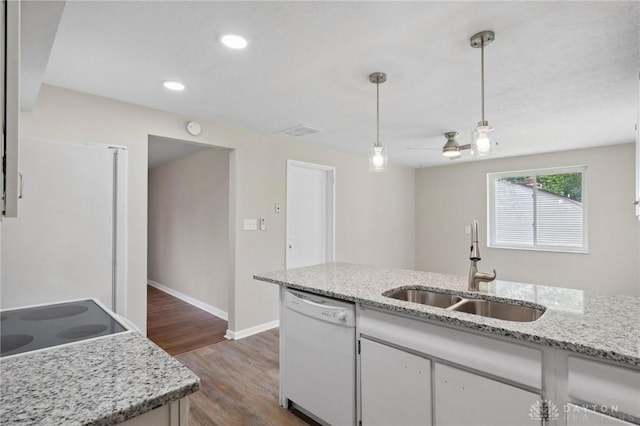 40 Rosewood Dr, Springboro, OH 45066 - kitchen with dishwasher, dark wood-type flooring, pendant lighting, recessed lighting, and light stone countertops
