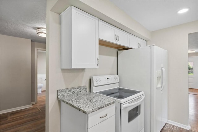 40 Rosewood Dr, Springboro, OH 45066 - kitchen featuring white appliances, wood finished floors, white cabinets, light stone countertops, and recessed lighting