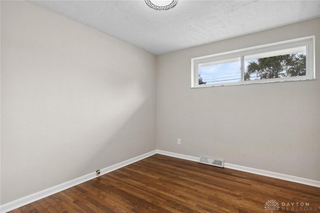 40 Rosewood Dr, Springboro, OH 45066 - unfurnished room with baseboards and dark wood finished floors