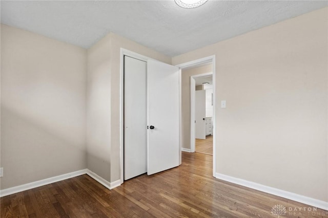 40 Rosewood Dr, Springboro, OH 45066 - unfurnished bedroom with wood finished floors and a closet