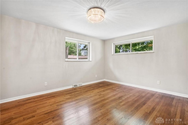 40 Rosewood Dr, Springboro, OH 45066 - unfurnished room with plenty of natural light and wood-type flooring