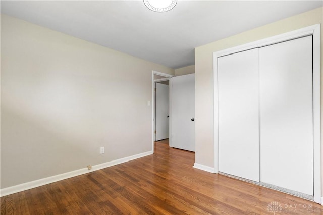 40 Rosewood Dr, Springboro, OH 45066 - unfurnished bedroom with wood finished floors and a closet