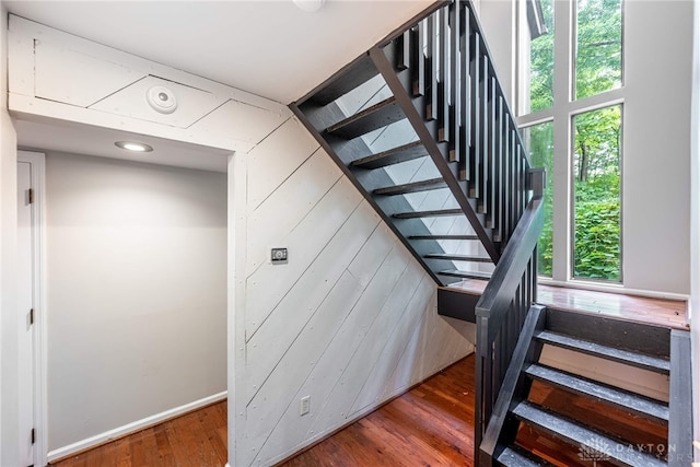 1839 Quail Hollow Rd, Washington Twp, OH 45459 - stairway featuring plenty of natural light, wood finished floors, and wooden walls