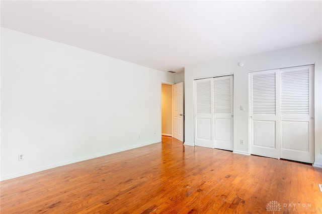 1839 Quail Hollow Rd, Washington Twp, OH 45459 - unfurnished bedroom with two closets and light wood-style flooring