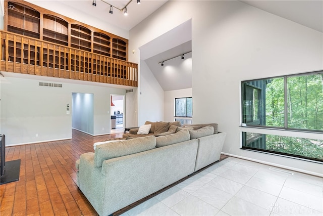 1839 Quail Hollow Rd, Washington Twp, OH 45459 - living area featuring rail lighting, high vaulted ceiling, and hardwood / wood-style floors