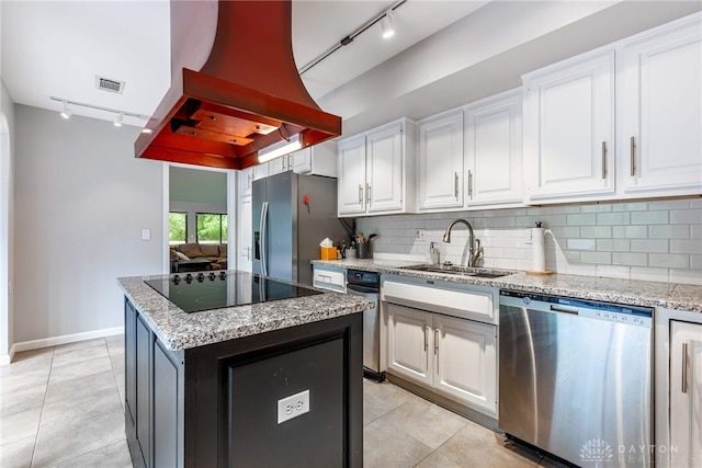 1839 Quail Hollow Rd, Washington Twp, OH 45459 - kitchen featuring track lighting, stainless steel appliances, island exhaust hood, and light tile patterned floors
