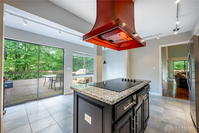 1839 Quail Hollow Rd, Washington Twp, OH 45459 - kitchen with track lighting, premium range hood, healthy amount of natural light, and black electric stovetop