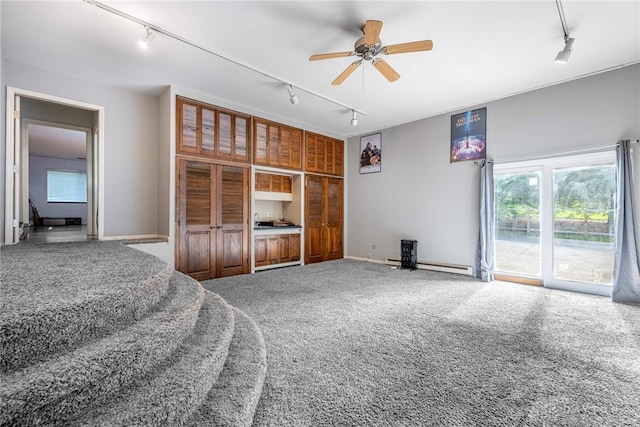 1839 Quail Hollow Rd, Washington Twp, OH 45459 - carpeted living area featuring rail lighting, ceiling fan, and a baseboard heating unit
