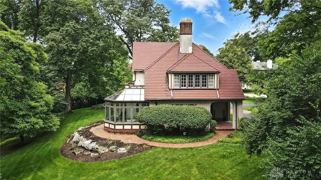 1160 Lytle Ln, Kettering, OH 45409 - back of house featuring a chimney, a yard, and a tile roof