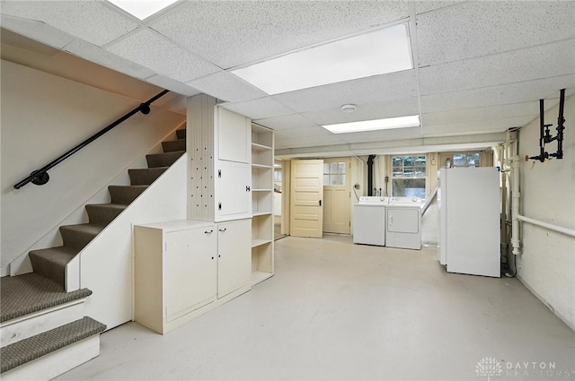 1160 Lytle Ln, Kettering, OH 45409 - below grade area featuring washer and dryer, freestanding refrigerator, stairs, and a paneled ceiling