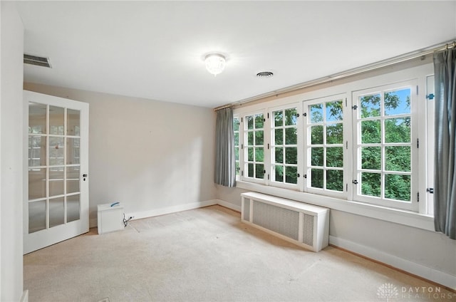 1160 Lytle Ln, Kettering, OH 45409 - unfurnished room featuring radiator heating unit and carpet flooring