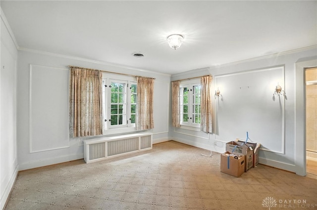 1160 Lytle Ln, Kettering, OH 45409 - empty room featuring radiator, ornamental molding, and a decorative wall