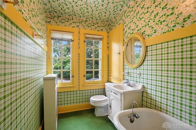 1160 Lytle Ln, Kettering, OH 45409 - bathroom with wallpapered walls, a freestanding bath, and vanity