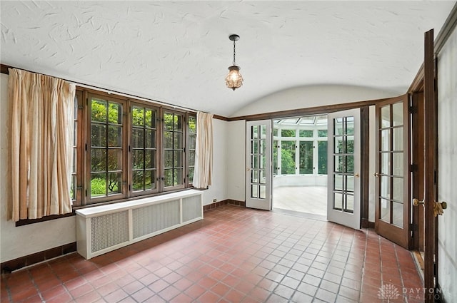 1160 Lytle Ln, Kettering, OH 45409 - unfurnished room with french doors, radiator, vaulted ceiling, tile patterned flooring, and a textured ceiling