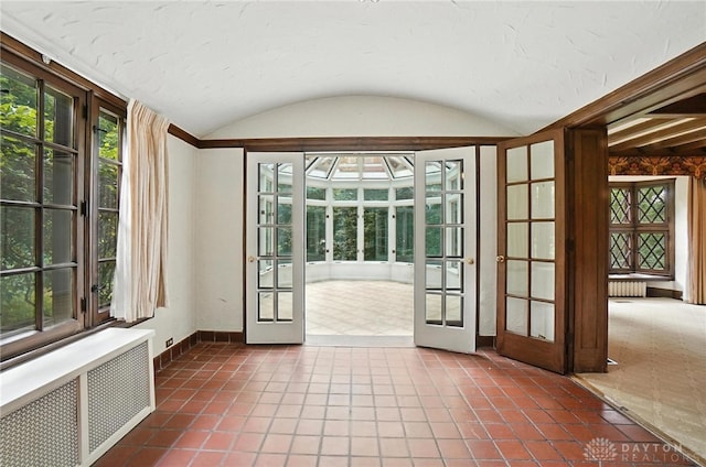 1160 Lytle Ln, Kettering, OH 45409 - unfurnished sunroom featuring radiator, french doors, and vaulted ceiling