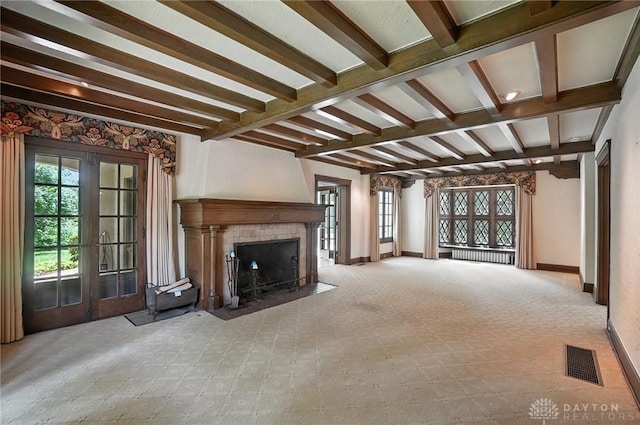 1160 Lytle Ln, Kettering, OH 45409 - unfurnished living room featuring beam ceiling, a fireplace, and carpet floors
