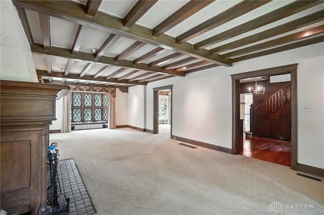 1160 Lytle Ln, Kettering, OH 45409 - unfurnished living room featuring beamed ceiling, a chandelier, stairs, and carpet