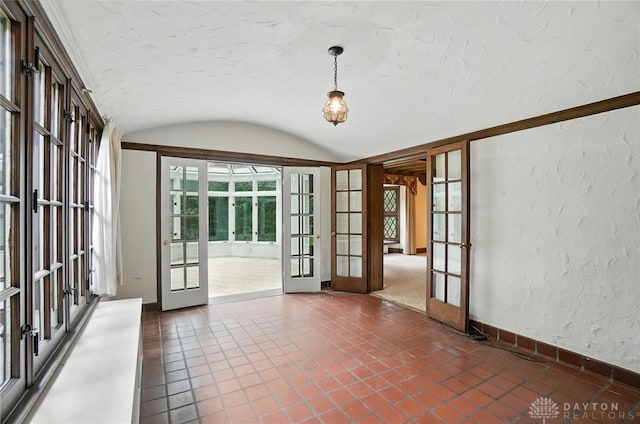 1160 Lytle Ln, Kettering, OH 45409 - tiled spare room featuring french doors, a textured wall, and vaulted ceiling