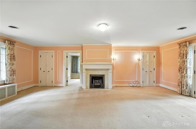 1160 Lytle Ln, Kettering, OH 45409 - unfurnished living room with a tiled fireplace, light carpet, and ornamental molding