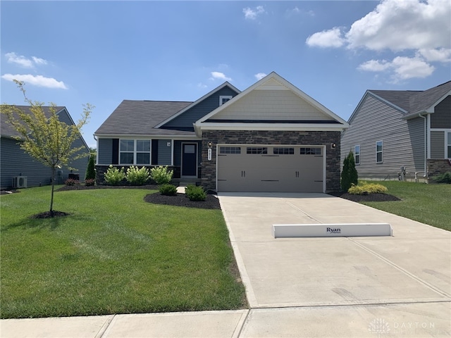 6655 Roycroft Dr, Middletown, OH 45042 - craftsman inspired home with an attached garage, a front yard, driveway, and stone siding