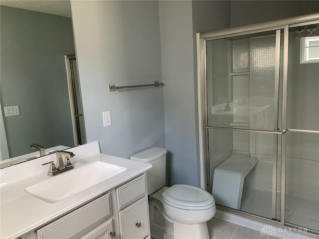 6655 Roycroft Dr, Middletown, OH 45042 - bathroom with a stall shower, vanity, and tile patterned floors