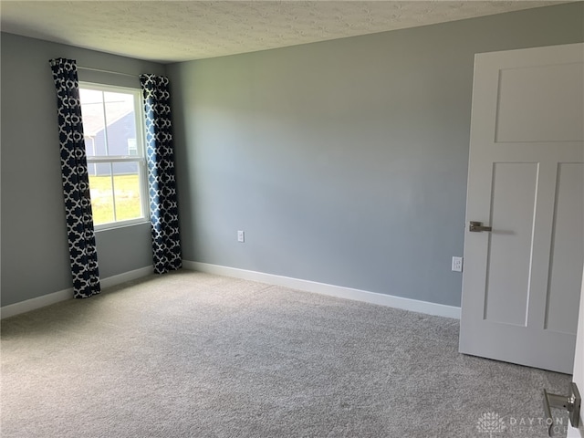 6655 Roycroft Dr, Middletown, OH 45042 - empty room featuring a textured ceiling and carpet flooring