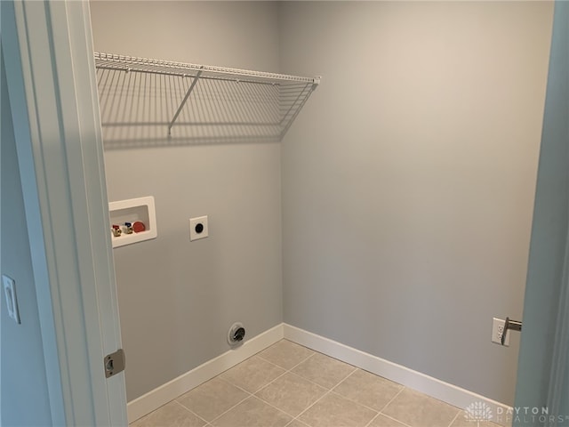 6655 Roycroft Dr, Middletown, OH 45042 - laundry area with hookup for an electric dryer, hookup for a washing machine, and light tile patterned flooring