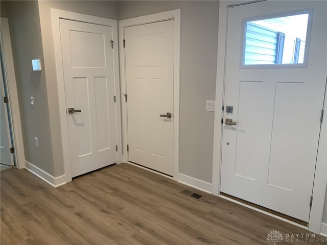 6655 Roycroft Dr, Middletown, OH 45042 - entryway with baseboards and wood finished floors