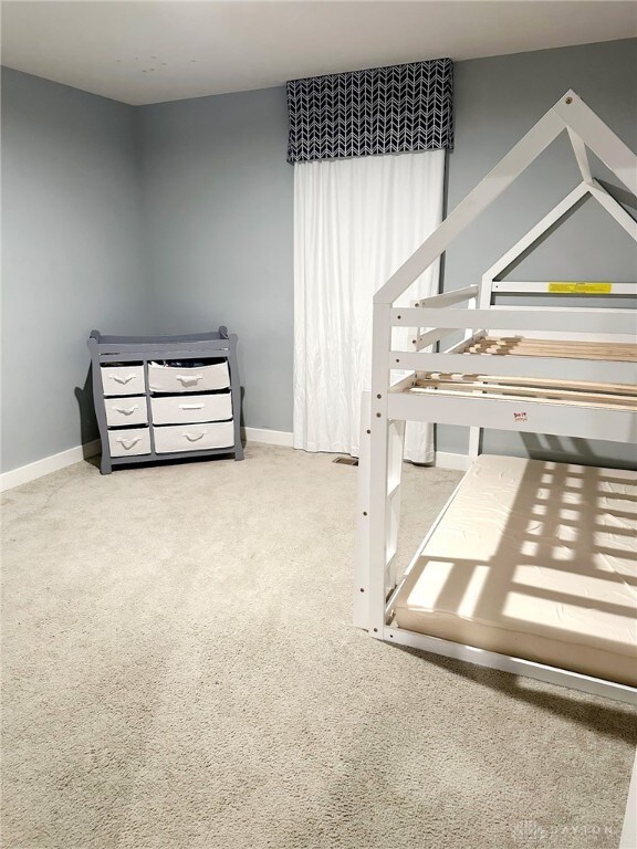 6655 Roycroft Dr, Middletown, OH 45042 - unfurnished bedroom with carpet and baseboards